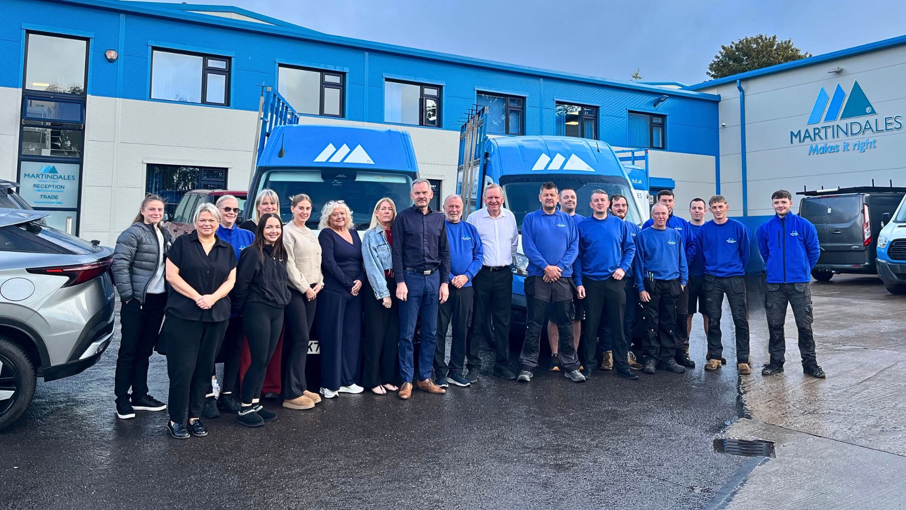 The Martindales team gathered outside the Union Road headquarters in Bolton, marking 40 years in business